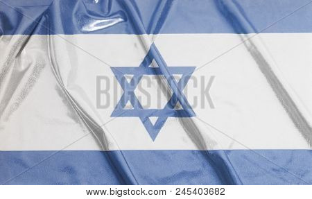Rippled Waving Flag Of Israel Background Close Up .