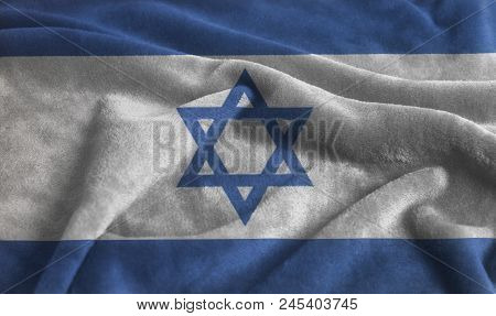 Rippled Waving Flag Of Israel Background Close Up .
