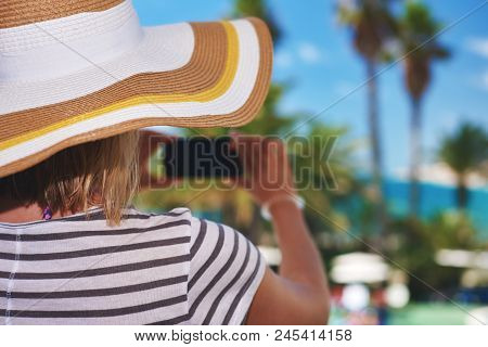 Young Woman In Sunhat Making Photo Of Amazing Sea View With Her Cellphone Santa Susanna. Cataluna. S