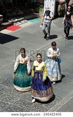 SEOUL-SOUTH KOREA, MAY 18, 2018:  three young woman wearing tradional dress in the street of Seoul in south Korea.