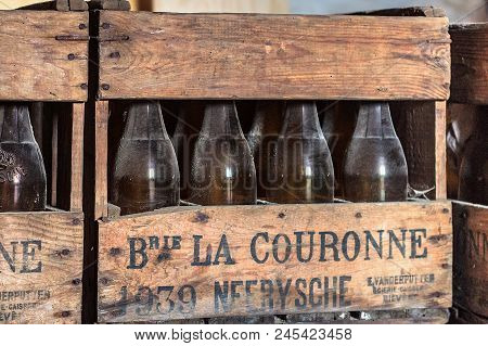 Neerijse, Belgium - September 05, 2014: Wooden Box With Old Vintage Beer Bottles In The Brewery De K