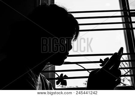 Asian Young Teenager Silhouette Woman Videophone With Smartphone In Home For Learning Online Study