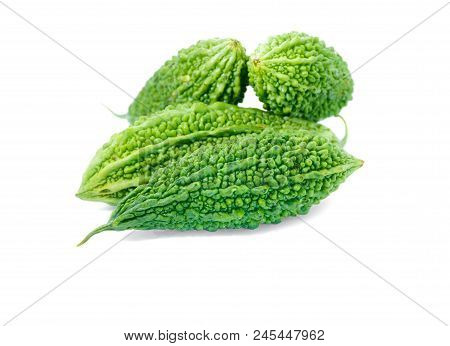 Bitter Gourd Pile On White Background. Vegetable Herb Nourish The Health Body
