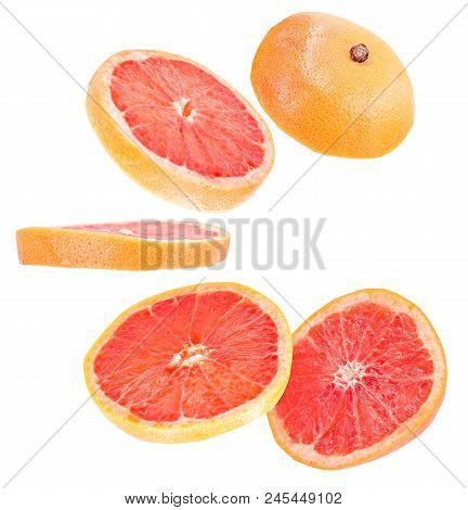 Creative Concept With Flying Grapefruit. Sliced Grapefruit Isolated On White Background. Levity Frui