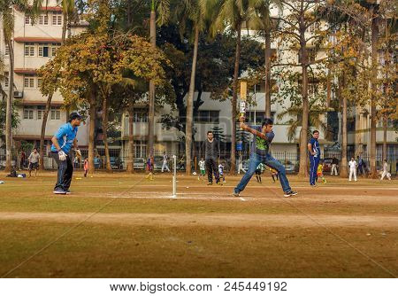Men Playing Cricket With Tennis Ball At Mumbai Grounds