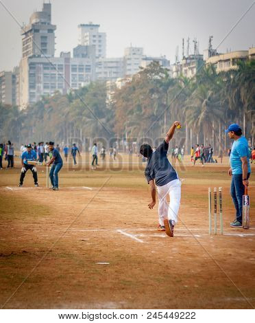 Men Playing Cricket With Tennis Ball At Mumbai Grounds