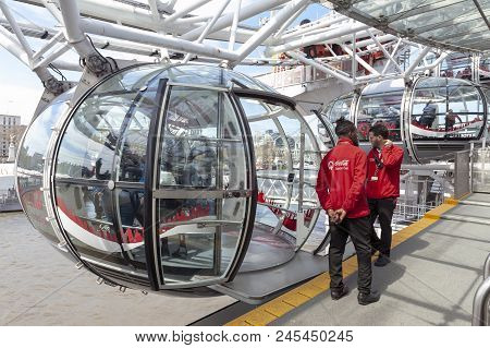 London, Uk - April 2018: Ovoidal Passenger Capsule Arriving At Boarding Platform Of The London Eye,