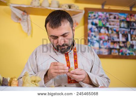 Professional Male Potter In Russian Ethnic Shirt Making Clay Figure For Medieval Popular Strategy Bo