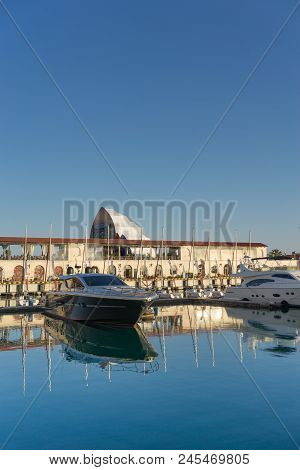 Sochi, Russia-june 14, 2018: Sea Port With Yacht Parking On The Background Of The Multimedia Screen 