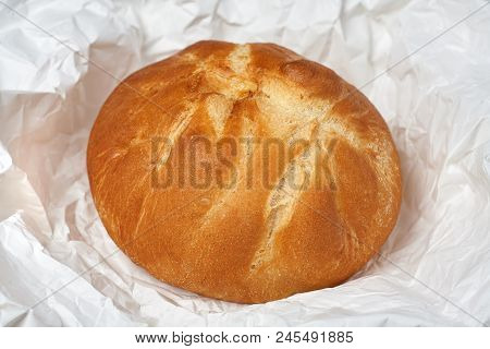 Fresh Homemade Bread On A Background Of White Paper.