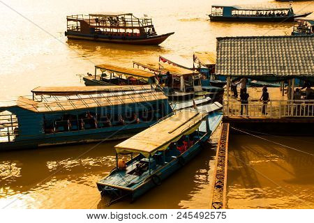 Many Boatsmen In Port Of Floating Village, Phnom Krom, Tonle Sap In Cambodia
