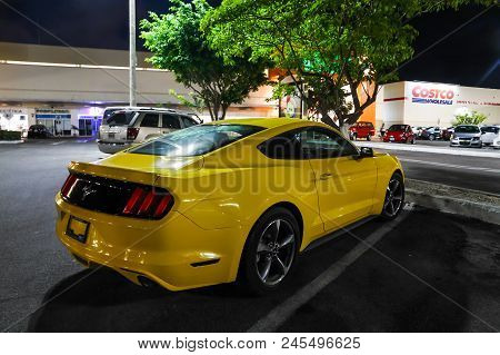 Cancun, Mexico - May 17, 2017: Yellow Muscle Car Ford Mustang In The City Street.