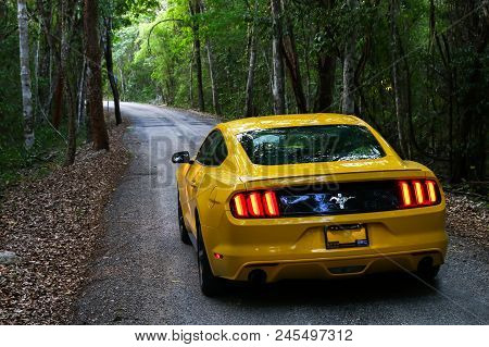 Xpujil, Mexico - May 19, 2017: Yellow Muscle Car Ford Mustang At The Countryside.