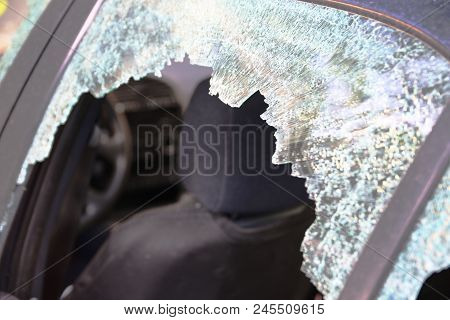 Broken Car Window And Cracked Glass Of A Automobile. Empty Copy Space For Editor Text.