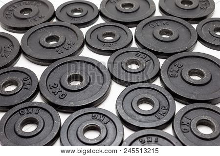 Black Metal Weights 1kg And 2kg On White Background.