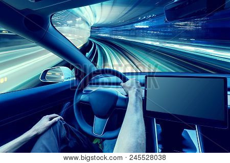 Person Driving A New Electric Vehicle From Inside