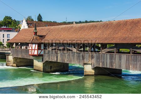 Medieval Bridge Over The Reuss River In The Town Of Bremgarten In Summertime. Bremgarten Is A Munici