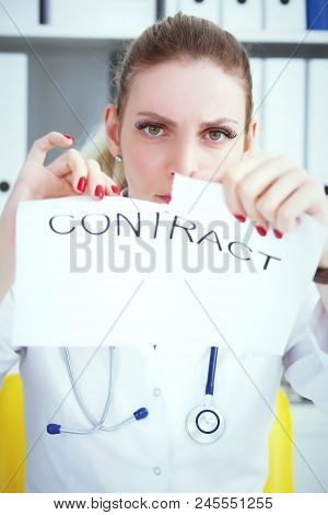 Hands Of Female Medicine Doctor Ripping Contract Closeup. Break The Rules - Failure Business Concept