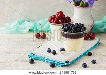 Italian Dessert Pana Cota With Berry Jam And Fresh Blueberries