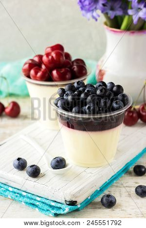 Italian Dessert Pana Cota With Berry Jam And Fresh Blueberries