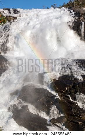 Photo Of Rapid Stunning Waterfall In Husedalen Valley, Norway. Aerial View. Summer Time.