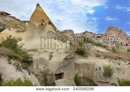 Residential Caves In The Cappadocia Mountains Against The Blue Sky