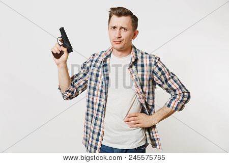 Shocked Sad Upset Young Man With Gun In Hand Isolated On White Background. Male With Handgun, No Sho
