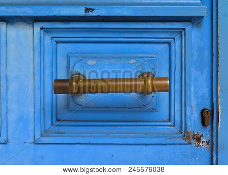 Blue Handle Door Rusty Iron Handle In Wood Doorway
