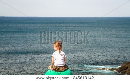 A Young Girl Sits On Her Dad's Shoulders And Admires The View Of The Ocean On Cape Schank, Victoria,