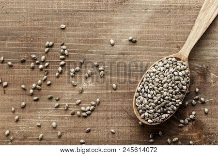 Hemp Seeds In A Rustic Wooden Spoon In A Wooden, Space For Text