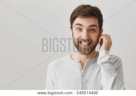 Wait My Favorite Song Is Coming. Portrait Of Attractive Cheerful Caucasian Boyfriend Listening Music