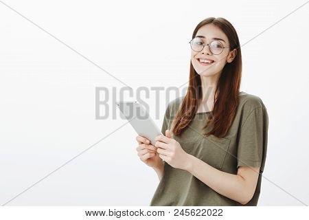 Beautiful Site Editor Checking Schedule During Worktime. Indoor Shot Of Good-looking Creative Female