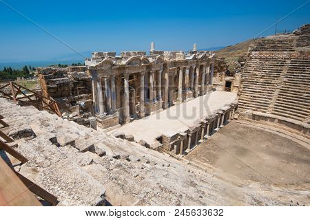 Roman amphitheatre in the ruins of Hierapolis, in Pamukkale, near modern turkey city Denizli, Turkey.