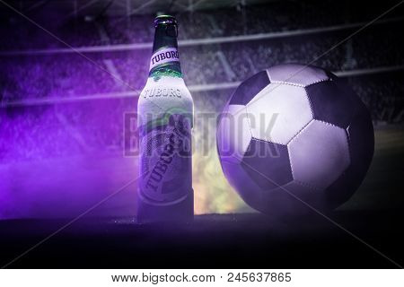 Baku,azerbaijan - June 15, 2018 : Creative Concept. Tuborg Glass Bottle Beer On Grass With Soccer Ba