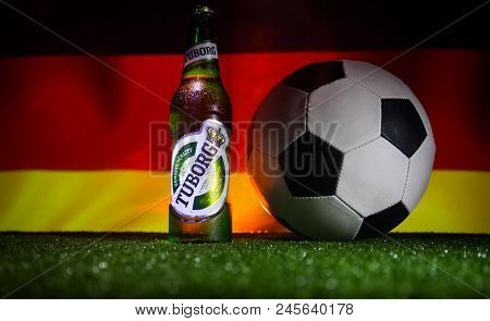 Baku,azerbaijan - June 15, 2018 : Creative Concept. Tuborg Glass Bottle Beer On Grass With Soccer Ba
