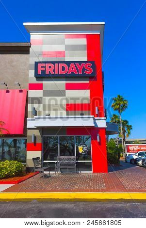 Orlando, Usa - May 8, 2018: Tgi Fridays Exterior And Logo. Tgi Fridays Is An American Restaurant Cha