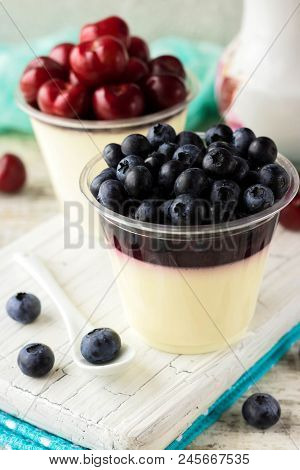 Italian Dessert Pana Cota With Berry Jam And Fresh Blueberries