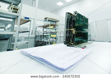 A New Electronic Module Is On The Assembly Table. Modern Production Of Electronic Devices.
