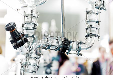 Fragment Of Chemical Reactor Equipment, Glass Pipe. Abstract Industrial Background.