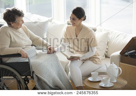 Disabled Woman With Medical Assistant