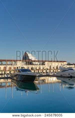 Sochi, Russia-june 14, 2018: Sea Port With Yacht Parking On The Background Of The Multimedia Screen 
