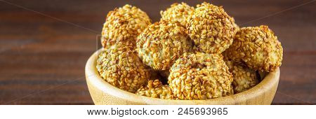 Cookies With Sesame Seeds On A Wooden Table