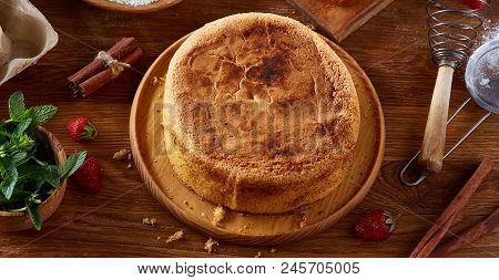 Top View Raw Ingredients For Cooking Strawberry Pie Or Cake On Wooden Table: Eggs, Sugar And Strawbe