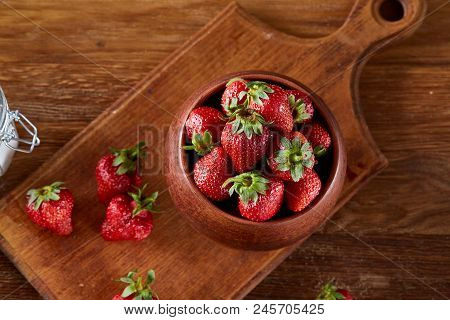 Fresh Strawberries For Cooking Cake In Wooden Bowl Over Rustic Background, Top View, Selective Focus