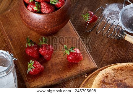 Fresh Strawberries For Cooking Cake In Wooden Bowl Over Rustic Background, Top View, Selective Focus