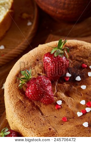 Baking Background With Strawberry Tart Covered With Whipped Sour Cream Surrounded By Organic Ingredi