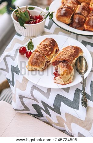 Homemade Baked Croissant With Fresh Garden Cherries