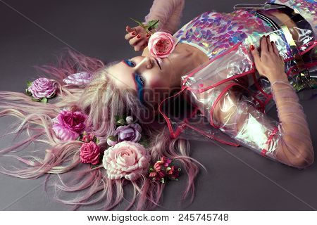 Gorgeous Woman In Biofuture Pompadour Style. Female In Fashion Transparent Raincoat With Splendid Ma