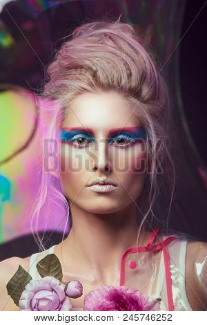 Gorgeous Woman In Biofuture Pompadour Style. Female In Fashion Transparent Raincoat With Splendid Ma