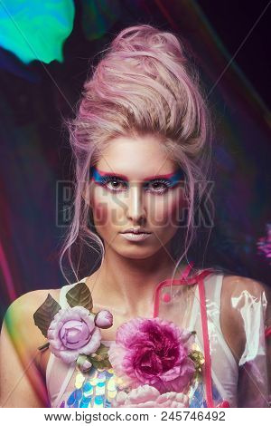 Gorgeous Woman In Biofuture Pompadour Style. Female In Fashion Transparent Raincoat With Splendid Ma